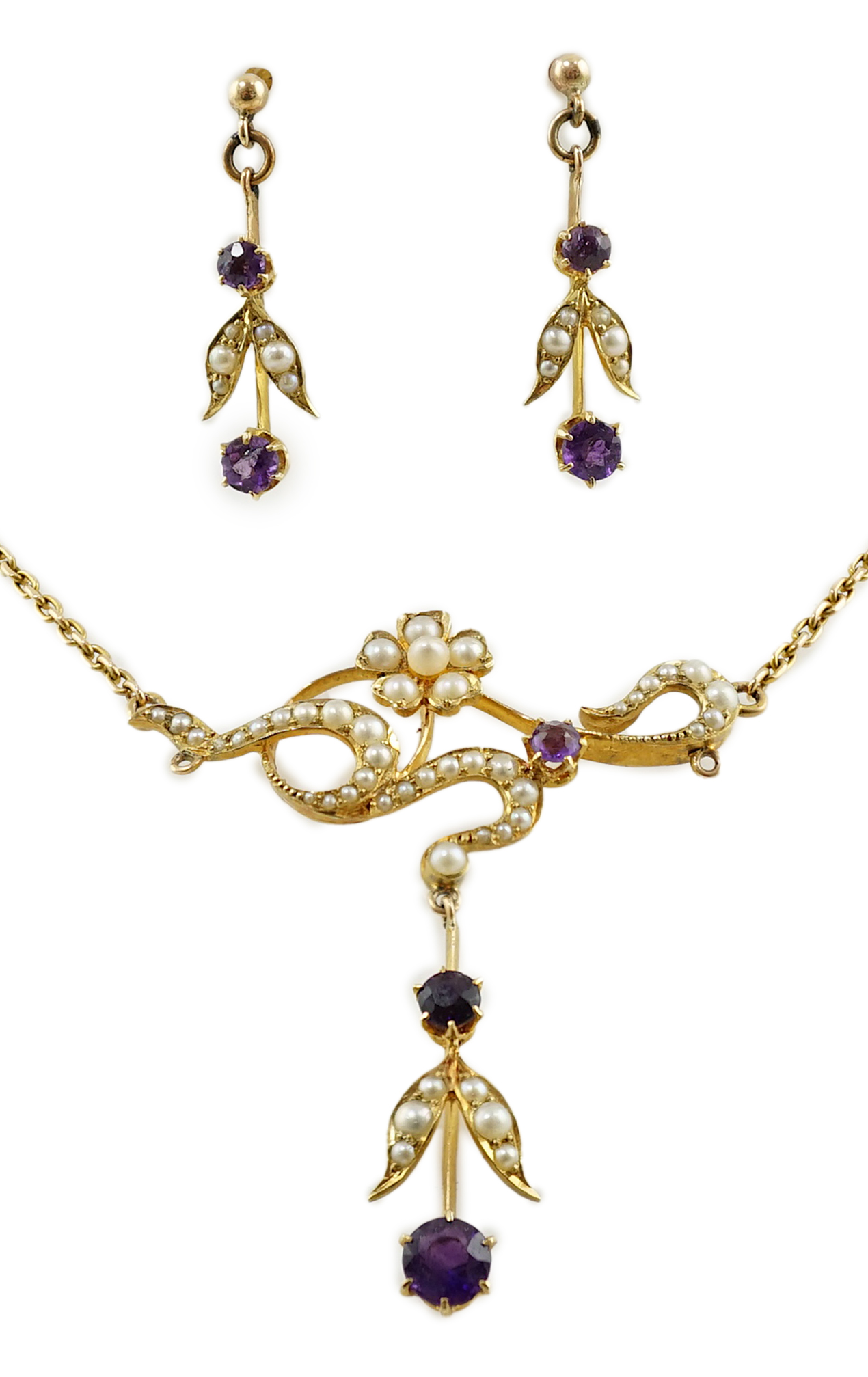 An Edwardian 15ct gold, seed pearl and amethyst set drop necklace and a pair of matching unmarked earrings